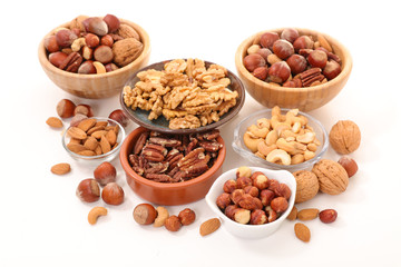 assorted of nuts in bowl isolated on white background