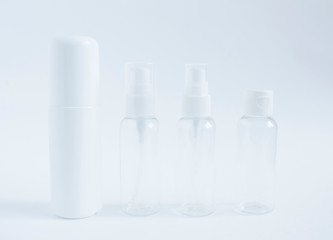 Set of empty beauty cosmetic plastic containers on a white  background. Collection of skincare spa products. Natural beauty product concept. Closeup.