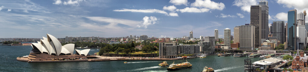 Fototapeta premium Panorama Sydney Cove i Harbour of Sydney, Australien, widok na Skyline Sydney i Sydney Opera House. Widziane z Sydney Harbour Bridge.