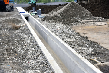 Construction site - residential land development : burial of u-shaped gutter