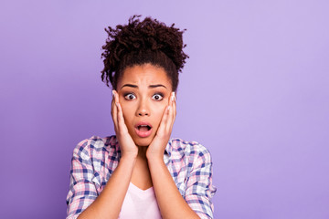 Close up photo disappointed frightened lady impressed astonished by unbelievable unexpected event have fear anxious confused open mouth top-knot dressed modern clothing isolated purple background