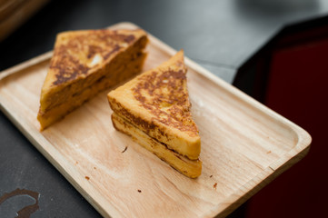 french toast with peanut butter in wood dish
