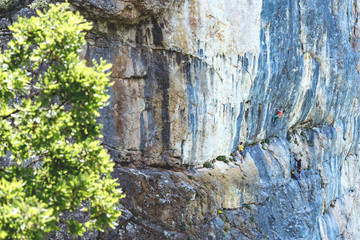 People climbing rock mountain.