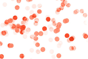 Bright coral confetti isolated on white background.