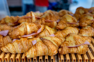 Closeup photo of cheese ham croissant in pastry shop
