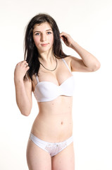 Obraz premium Young beautiful woman in a fashionable linen luxury brunette in the Studio
