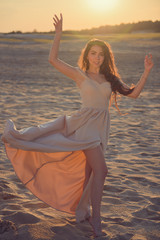 Woman in evening dress in the desert