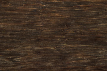 Dark brown wooden background, top view
