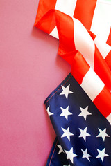 American flag on a light pink background.