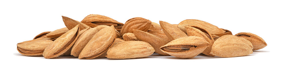 Almonds heap isolated on white background. Panorama of almonds unpeeled closeup. Nuts collection