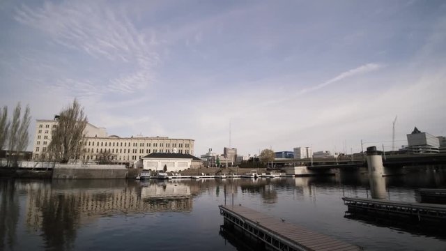 Pan Right on Downtown Buildings Along Milwaukee River Walkway