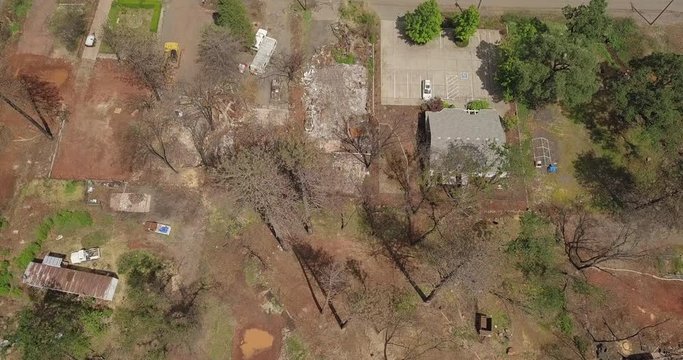 Paradise California Camp Fire destroyed Paradise city after wildfire aerial drone parallax tilt down shot