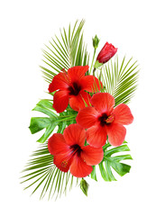 Red hibiscus flowers and palm leaves in a tropical arrangement
