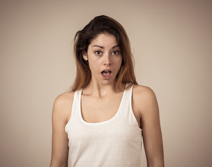 Fototapeta premium Happy young attractive woman shocked with surprised funny face. Human expressions