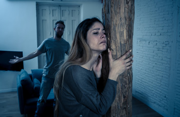 Fototapeta premium Abuser Husband intimidating and beating his wife illustrating domestic violence