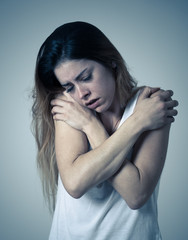 Young attractive woman sad and depressed feeling desperate. Human expressions and emotions