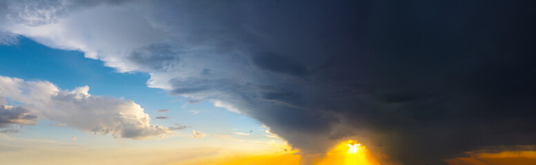 dramatic cloudy sky at the sunset panorama