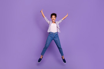 Fototapeta na wymiar Full length body size view photo careless childish teen top knot amazed enjoy free time summer holidays scream shout wow unbelievable relax dream dreamy checked shirt jeans isolated purple background