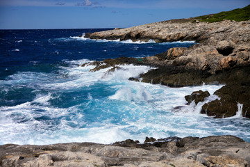Fototapeta na wymiar waves on cliff, Tremiti archipelago. Apulia, Italy