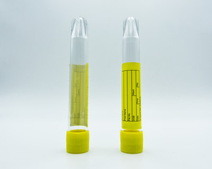 Test tube with yellow plug isolated on white background