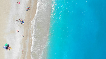 Fototapeta na wymiar Aerial. Sea beach with people. Top view.