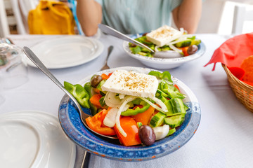 greek salad with feta cheese in a plate at the restaurant