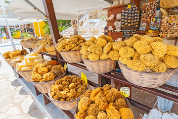 A marketplace selling bathing sponges to tourists
