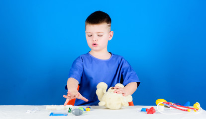 pediatrician intern. little boy in medical uniform. hospital. medicine and health. Treatment prescription. kid doctor with stethoscope. nurse laboratory assistant. family doctor. sick and ill