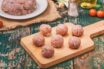 Homemade food. Raw fish ball (uncooked) in the kitchen with vegetables