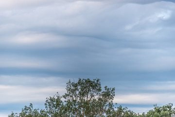 Obraz premium Cloudscape of Overcast Sky with Layers of Clouds in Blues and Grays
