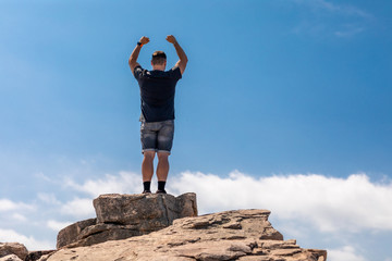 Excited Man On Top In A Beautiful Summer Landscape