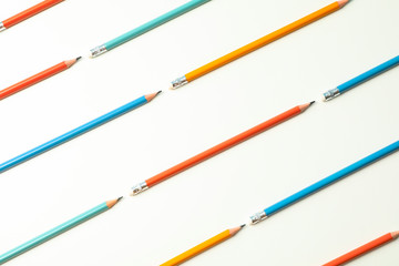 Flat lay composition with pencils on white background, space for text