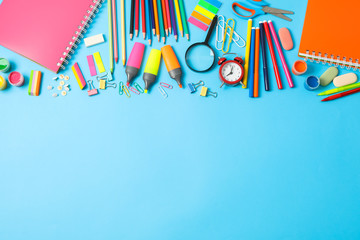 Flat lay composition with school supplies on color background, space for text © Atlas