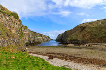 The tidal inlet at the entrance to Smoo Cave in Durness, Scotland, UK