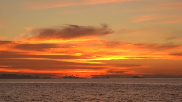 Beautiful sunset over sea water wave. Summer vacation concept. Island Koh Phangan, Thailand, establishing shot