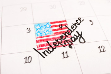 Calendar with marked date of Independence Day, closeup