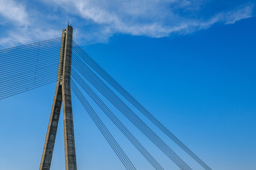 details of cable bridge in Riga latvia in summer by the river of Daugava