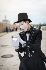 Mime on the street waiting to meet with his lover