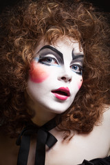 Woman mime with theatrical makeup. Close-up shot