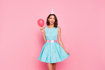 Close up photo amazing beautiful she her lady attractive pretty appearance birthday cap head came first hand arm red balloon shy person wear shiny colorful blue dress isolated pink bright background