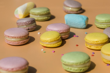 Colorful macaroons and marshmallow with heart shape sprinkles