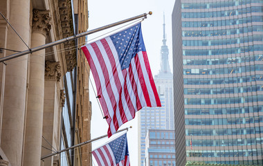 American flag, Manhattan downtown, blur Empire state building on the background