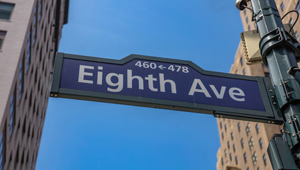8th ave, Manhattan New York downtown. Blue color street signs,