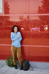  Young woman outdoors doing activities, with casual and modern style.