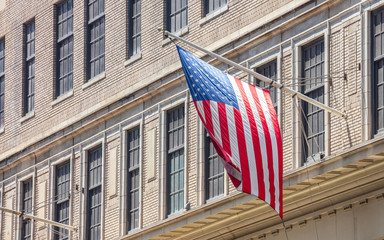 Fototapeta premium American flag in Manhattan New York downtown
