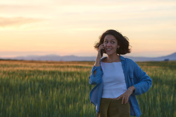  Young woman outdoors doing activities, with casual and modern style.