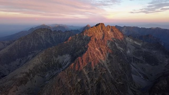 Morning timelapse aerial view of Gerlachov Peak (Gerlachovsky stit) and High Tatras mountains, Slovakia