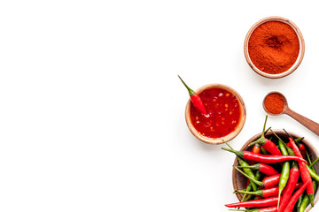 Dry powder and fresh red and green chilli pepper as food ingredient on white table background top view mockup
