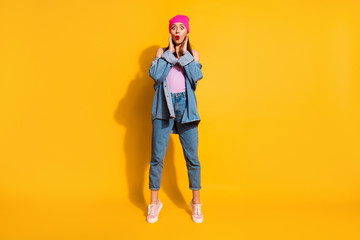 Fototapeta premium Full length body size view photo of attractive astonished impressed lady hear model incredible novelty sneakers isolated fashionable yellow bright background