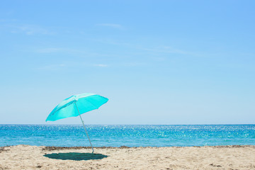 Sun umbrella on the sandy beach.